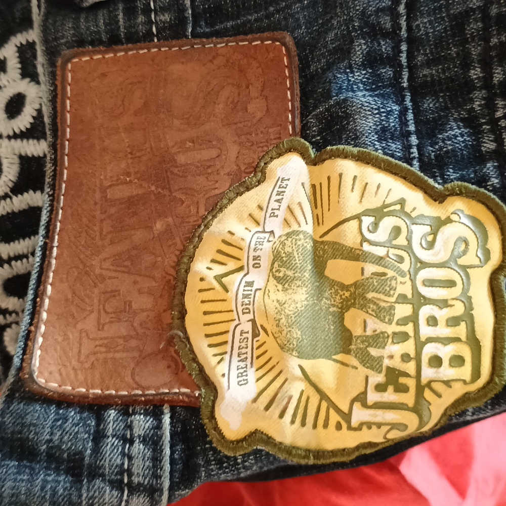 Akademiks Dark Denim Jeans with Orange Accents